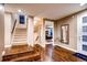 Bright and spacious entryway with hardwood floors and a staircase at 370 S Glencoe St, Denver, CO 80246