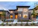 Modern two-story home with brick accents and landscaped front yard at 370 S Glencoe St, Denver, CO 80246