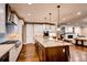 Gourmet kitchen boasts granite island and stainless steel appliances at 370 S Glencoe St, Denver, CO 80246