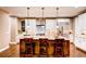 Elegant kitchen with granite island, stainless steel appliances, and hardwood floors at 370 S Glencoe St, Denver, CO 80246
