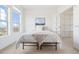 A bright bedroom with a large window and a walk-in closet with wire shelving at 13456 Via Varra # 428, Broomfield, CO 80020