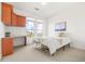 A bright bedroom featuring a built-in desk and overhead cabinets and mountain view at 13456 Via Varra # 428, Broomfield, CO 80020