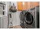 A laundry room with side by side washer and dryer at 13456 Via Varra # 428, Broomfield, CO 80020