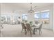 Open-concept space with dining area and living room with a sliding glass door leading to a balcony at 13456 Via Varra # 428, Broomfield, CO 80020