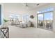Bright living room featuring plush seating, modern decor, and balcony access with furniture at 13456 Via Varra # 428, Broomfield, CO 80020