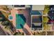 Overhead view of a large pool with a cover, a smaller uncovered pool, and buildings nearby at 13456 Via Varra # 428, Broomfield, CO 80020