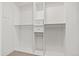 A well-organized walk-in closet with white shelving and drawers at 13456 Via Varra # 428, Broomfield, CO 80020
