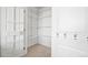 A walk-in closet with white wire shelving and a closet door at 13456 Via Varra # 428, Broomfield, CO 80020