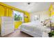 Comfortable bedroom with large window, white furniture set, and neutral accents at 14595 Robins Dr, Denver, CO 80239