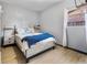 Bedroom with light gray walls, laminate flooring, and modern furniture at 14595 Robins Dr, Denver, CO 80239