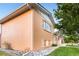 Well-maintained home exterior with brick siding, manicured lawn, and mature landscaping at 14595 Robins Dr, Denver, CO 80239