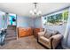 Living room area with wooden furniture and view of staircase at 14595 Robins Dr, Denver, CO 80239
