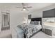 Bedroom featuring a patterned duvet on a king-sized bed and large windows with modern shades at 515 Bridger Ave, Fort Lupton, CO 80621