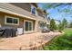 Outdoor patio features a fire pit, grill, and a table with seating at 17332 E Lake Ln, Aurora, CO 80016
