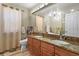 Bathroom features double vanity, large mirror, and plenty of counter space at 17332 E Lake Ln, Aurora, CO 80016