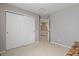 Open bedroom with closet and view to the hallway; a clean, neutral space at 17332 E Lake Ln, Aurora, CO 80016