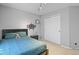 This bedroom offers natural light and a neutral color scheme, complete with a closet at 17332 E Lake Ln, Aurora, CO 80016