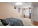 Bright bedroom offers ample space with large windows, carpet and queen size bed at 17332 E Lake Ln, Aurora, CO 80016