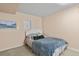 Charming bedroom with a plush carpet, neutral walls, and cozy queen sized bed at 17332 E Lake Ln, Aurora, CO 80016