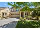 Charming two-story home featuring a well-maintained lawn and inviting front porch at 17332 E Lake Ln, Aurora, CO 80016