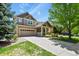 Beautiful two-story home with a manicured lawn and inviting curb appeal at 17332 E Lake Ln, Aurora, CO 80016