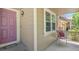 Inviting front porch with seating and a welcoming entrance at 17332 E Lake Ln, Aurora, CO 80016