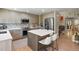 Modern kitchen with stainless steel appliances and a center island with seating at 17332 E Lake Ln, Aurora, CO 80016