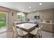Modern kitchen featuring sleek cabinets, stainless steel appliances, and a large island with seating at 17332 E Lake Ln, Aurora, CO 80016