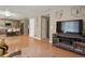 Open-concept living space that blends the kitchen into a well-furnished living room and dining area at 17332 E Lake Ln, Aurora, CO 80016