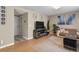 Spacious living room featuring a modern entertainment center and comfortable seating at 17332 E Lake Ln, Aurora, CO 80016