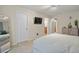 Neutral main bedroom with natural light, TV, and ensuite; a soothing retreat at 17332 E Lake Ln, Aurora, CO 80016
