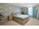 Serene main bedroom with plush carpeting and designer wallpaper; perfect for relaxation at 17332 E Lake Ln, Aurora, CO 80016