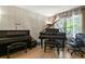 Comfortable office featuring hardwood floors, natural light, and a grand piano at 17332 E Lake Ln, Aurora, CO 80016