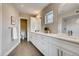 Contemporary bathroom featuring double sinks, tile flooring, and modern fixtures at 2473 S Cherokee St, Denver, CO 80223