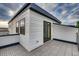 Private roof deck with deck tiles and access to the outside via a sliding glass door at 2473 S Cherokee St, Denver, CO 80223