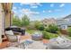 Landscaped backyard features patio seating and well-maintained lawn at 10197 Quintero St, Commerce City, CO 80022