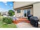 Backyard with patio, outdoor furniture, and manicured lawn at 10197 Quintero St, Commerce City, CO 80022