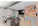 Finished basement featuring a sectional sofa, large screen TV, and wet bar area at 10197 Quintero St, Commerce City, CO 80022