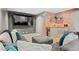 Finished basement with a wet bar area and comfortable sectional sofa with throw pillows at 10197 Quintero St, Commerce City, CO 80022