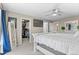 A spacious bedroom with a view of a well-organized walk-in closet and a white framed mirror at 10197 Quintero St, Commerce City, CO 80022