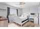 Comfortable bedroom with light blue walls, white furniture, and lots of natural light at 10197 Quintero St, Commerce City, CO 80022