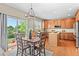 Bright dining area with wood floors and a sliding glass door, perfect for Gathering meals at 10197 Quintero St, Commerce City, CO 80022