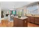 Kitchen flows to dining area with stainless appliances and natural light from window at 10197 Quintero St, Commerce City, CO 80022