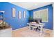 Bright blue office with built in desk and chair, with neutral carpet and decor at 10197 Quintero St, Commerce City, CO 80022