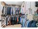 Organized walk-in closet with ample hanging space, shelving for shoes, and lots of storage at 10197 Quintero St, Commerce City, CO 80022