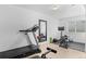 Bright workout room with treadmill, weights and mirror at 10197 Quintero St, Commerce City, CO 80022