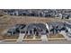 Aerial view of modern homes in a neighborhood, showcasing the architectural styles and community layout at 7125 Skygazer St, Castle Pines, CO 80108