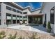Stylish outdoor patio area with seating, fire pit, and modern architectural design at 7125 Skygazer St, Castle Pines, CO 80108
