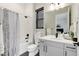 Clean bathroom with modern fixtures, a shower/tub combo, and ample vanity storage at 7125 Skygazer St, Castle Pines, CO 80108