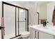 Stylish bathroom with a glass-enclosed shower, modern fixtures, and a bright vanity at 7125 Skygazer St, Castle Pines, CO 80108